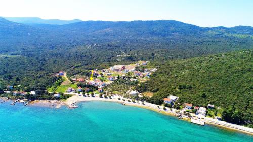 a group of people on a beach in the water at Apartments Lemeš in Drače