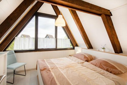 Ένα ή περισσότερα κρεβάτια σε δωμάτιο στο Ferienhaus Küstenkind - Top Lage - Garten eingezäunt