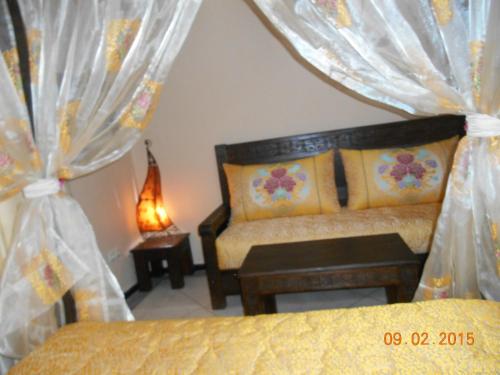 
A bed or beds in a room at Tigmi Dar Samy
