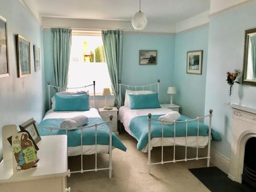 Ліжко або ліжка в номері The Quays Mansion in Christchurch