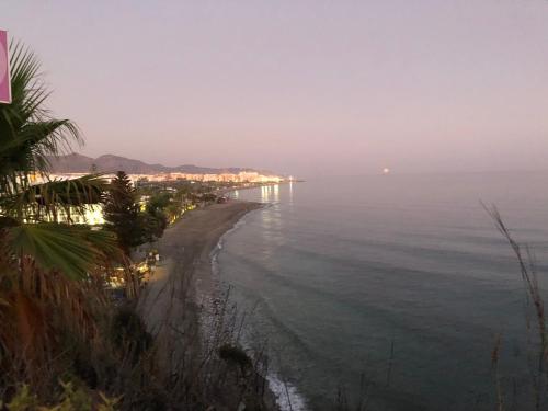 a view of a beach with the ocean at Hostal Avalon in Nerja