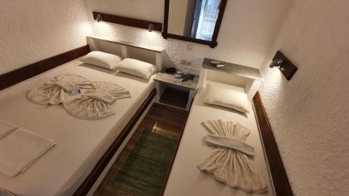an overhead view of a bed with towels on it at Haus Maria in Nea Potidaea