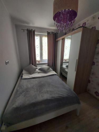 Ένα ή περισσότερα κρεβάτια σε δωμάτιο στο Apartament Cristal Comfort 1