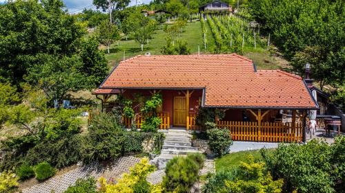 a small house with an orange roof and a pathway to it at Kuca za odmor Hiza i Vila in Krapina