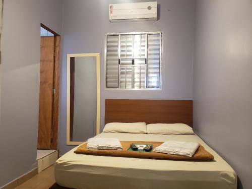 Ένα ή περισσότερα κρεβάτια σε δωμάτιο στο Pousada Beira Mar