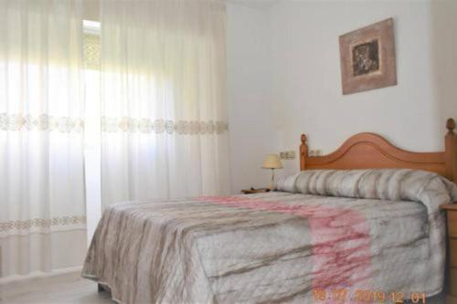 Postel nebo postele na pokoji v ubytování Apartamento Turistico Galeno