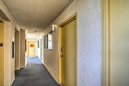 an empty hallway with a door and a hallwayngth at 1 Block to Ocean Shore Condo in Myrtle Beach! in Myrtle Beach