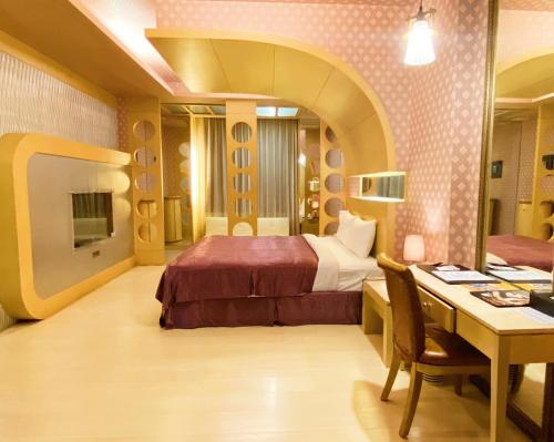 Llit o llits en una habitació de Hua Xiang Motel