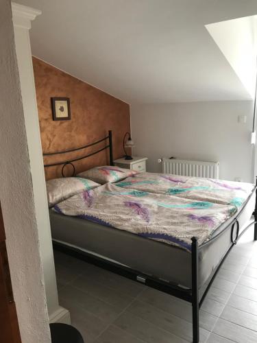 a bedroom with a large bed with a wooden headboard at Apartments Barbara in Poreč
