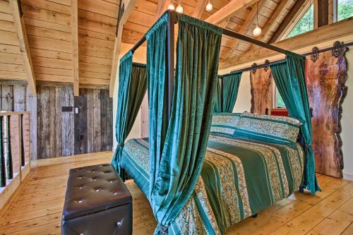 a bedroom with a bed with a canopy at Red Sweetheart Barn Studio with Mtn and River Views! in Westminster