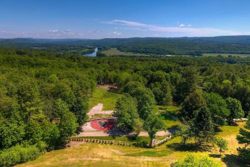 an aerial view of a park with trees at Red Sweetheart Barn Studio with Mtn and River Views! in Westminster