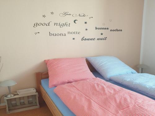 a bedroom with two beds with stars on the wall at Fewo Pfalzwohnung in Ellerstadt