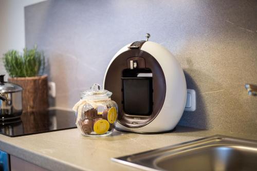 a soap dispenser sitting on a counter next to a sink at Das Tannacker - Ferienwohnungen Hartmann in Fischen