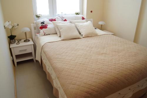 Postel nebo postele na pokoji v ubytování Yasumi Apartament