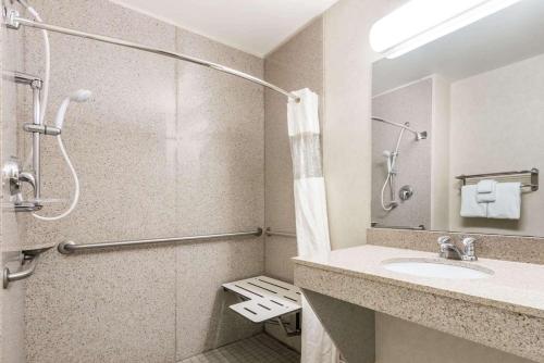a bathroom with a shower and a sink at Wingate by Wyndham Moab in Moab