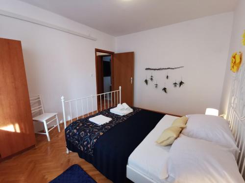 Postel nebo postele na pokoji v ubytování Apartments Lucia