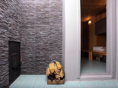a box of luggage sitting next to a brick wall at Joosepi Holiday House in Silla