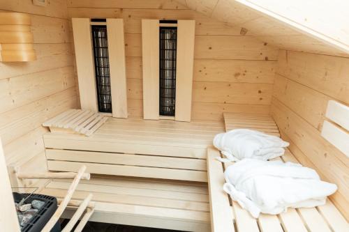an interior of a sauna with two beds at Pension Hartmann in Fischen