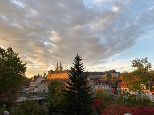 a view of a city with a church in the background at Ferienwohnung Dom- u. Regnitzblick in Bamberg