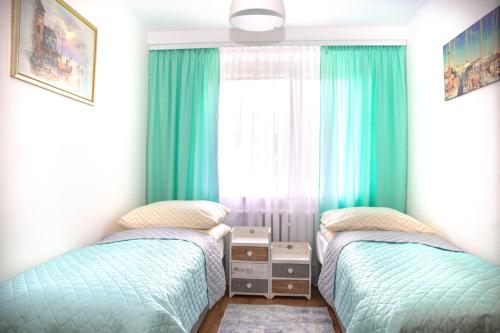 Posteľ alebo postele v izbe v ubytovaní Apartament Panorama 2 18