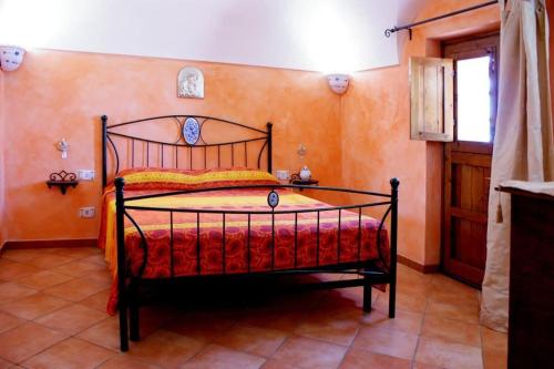 a bedroom with a bed in a room at Dammusi di Sofia in Pantelleria