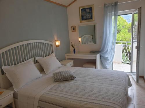 Postel nebo postele na pokoji v ubytování Apartments Kuzmanic