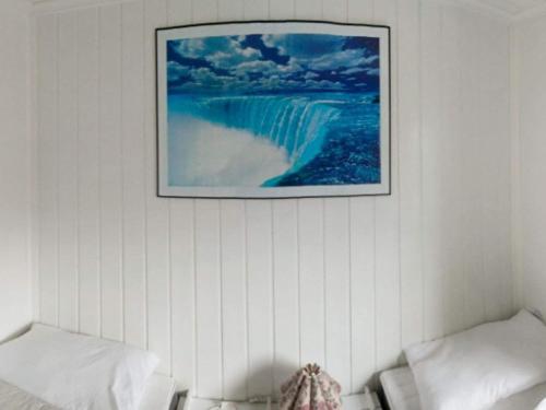 a picture of a waterfall on a wall at 6 person holiday home in Storfosna-By Traum in Sletta