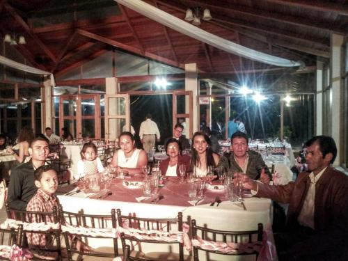 a group of people sitting around a table at Eco Arazzá in Mera