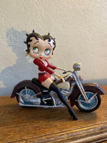 a figurine of a girl riding a motorcycle at Hôtel Bel'Air in Jausiers