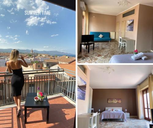 a woman is standing on the balcony of a hotel room at B&B Don Pedro Riposto in Riposto