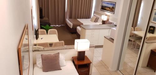 a view of a hotel room with a bedroom at Reef Palms in Cairns