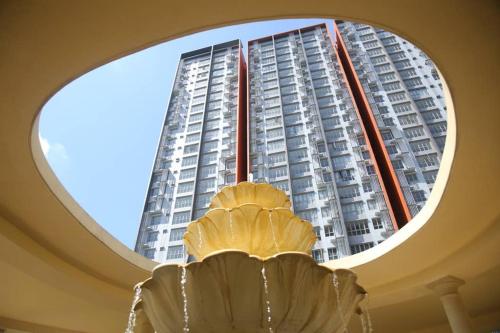a large window in a building with a building at Enjoy Modern, Spacious, Peaceful stay with Lake view - Gravit8 in Klang