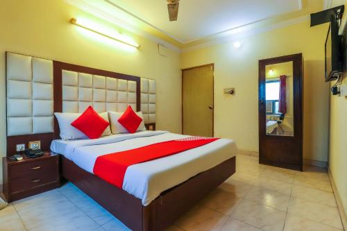 Llit o llits en una habitació de Hotel Sai Vatika Guest House