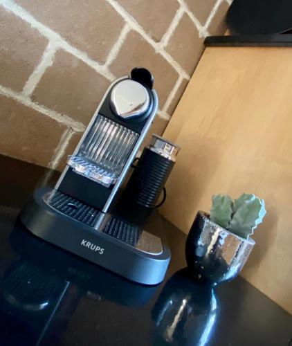 a hair dryer sitting on a table next to a vase at Ferienwohnung Fam.Stuchlik in Winkl