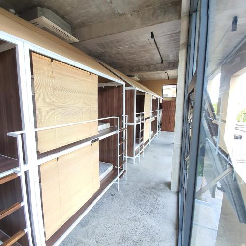 a row of empty stalls in a building at Cagina Boutique Hostel in Dong Hoi