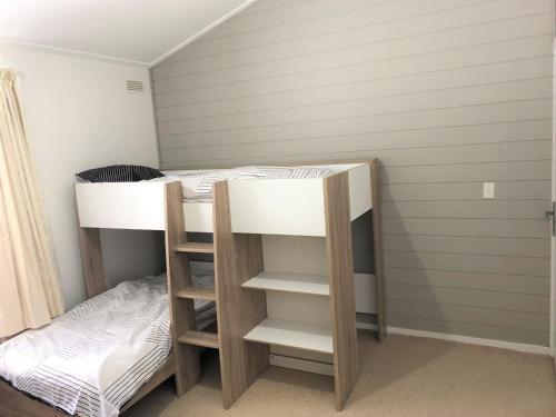a room with two bunk beds in it at Shamrock Apartment 4 in Mount Hotham
