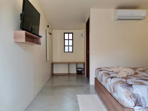 Una cama o camas en una habitación de SLEEP TIGHT at Chumphon