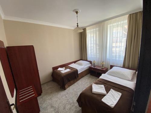 Ένα ή περισσότερα κρεβάτια σε δωμάτιο στο Hotel Morze