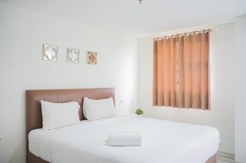 Minimalist Studio Bintaro Icon Apartment near British School By Travelio