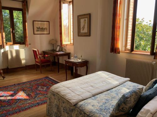 Llit o llits en una habitació de Château d'Argeronne "Le Pommier Doux"