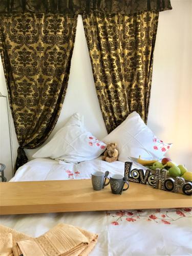a bed with a tray of fruit on it at Charming Villa with Private Swimmingpool in Attalens