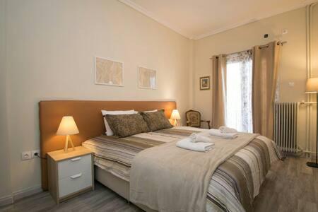 Postel nebo postele na pokoji v ubytování Relaxing by Acropolis