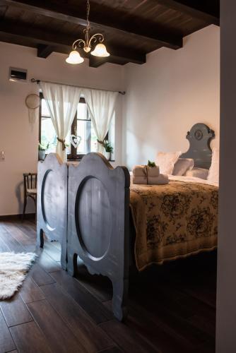 a bedroom with two beds in a room at Boróka Vendégház Tóalmás in Tóalmás