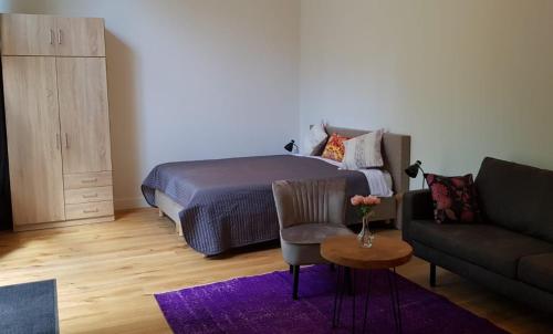 En eller flere senge i et værelse på Barbera Apartments Haarlem