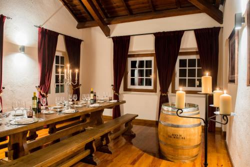 a dining room with a table and a wine barrel at Vila Gale Collection Alter Real - Resort Equestre, Conference & Spa in Alter do Chão