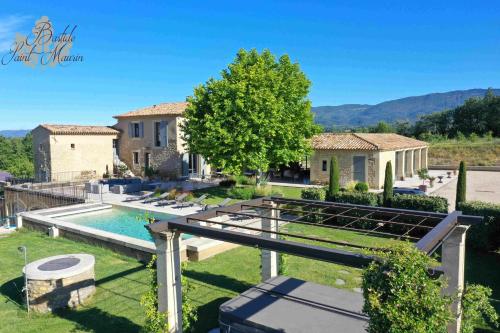 a backyard with a pool and a house at Bastide Saint Maurin in Ansouis