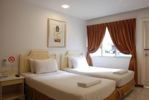 Katil atau katil-katil dalam bilik di Promenade Service Apartment
