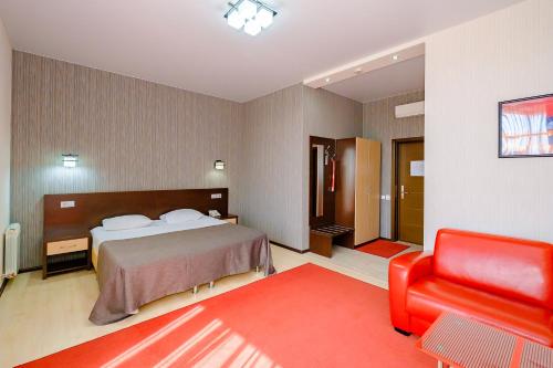 Avangard Hotel tesisinde bir odada yatak veya yataklar