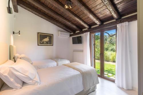 Llit o llits en una habitació de Villa Ionica