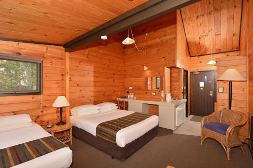 Postel nebo postele na pokoji v ubytování Kerikeri Homestead Motel & Apartments